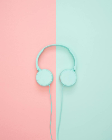 Abstract image of turquoise headphones on colorful background representing audio annotation services